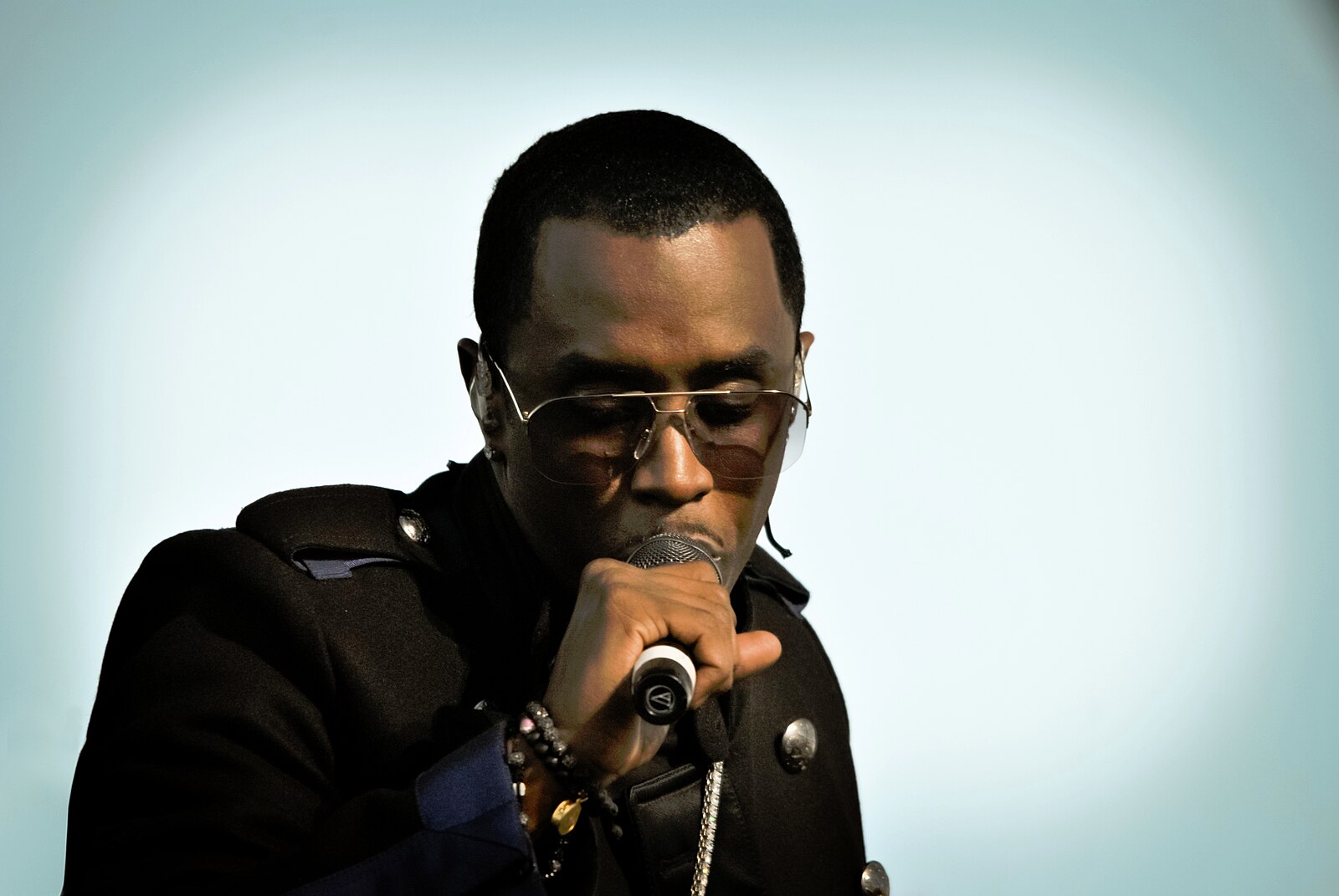 P Diddy singing into a microphone